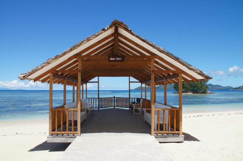 seychelles - la digue - small jetty - beach hut